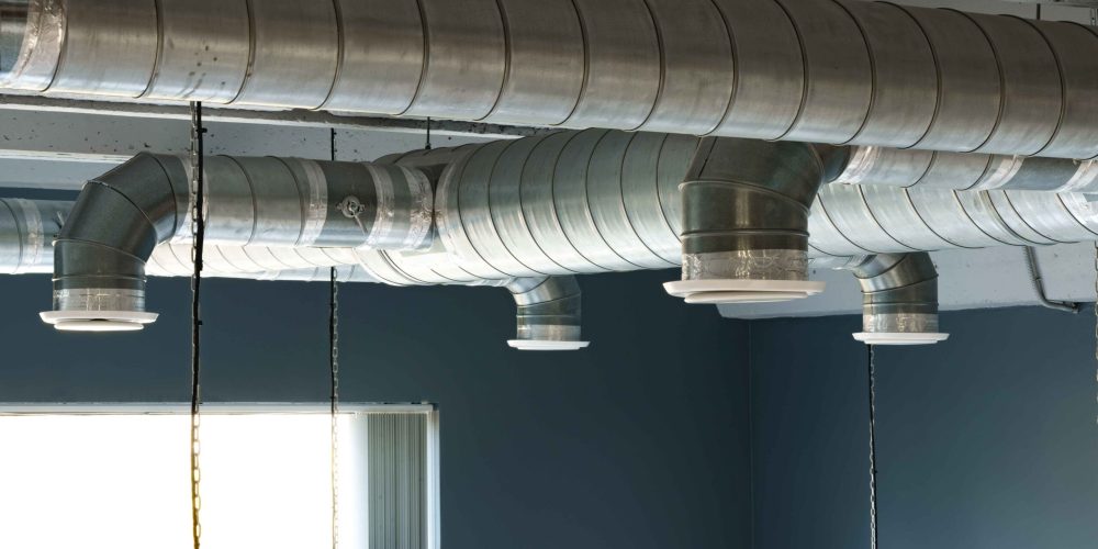 silver-ventilation-pipes-hanging-from-the-ceiling-2024-05-27-16-19-32-utc_11zon